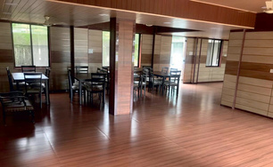 Community dining hall with wooden floors