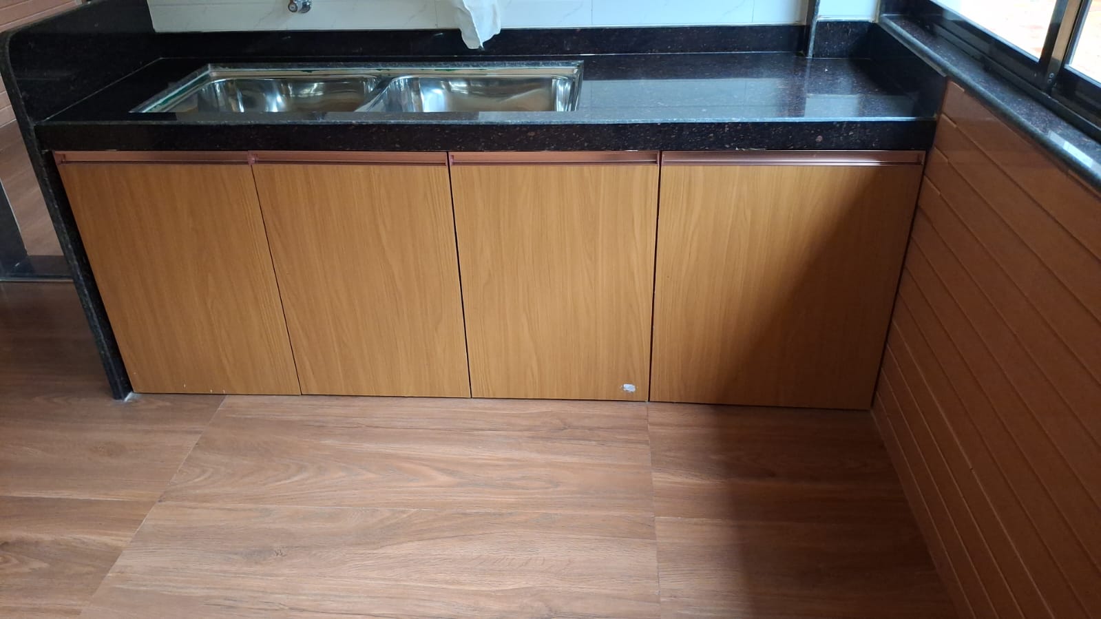 Veg kitchen counter with granite top and twin steel sinks